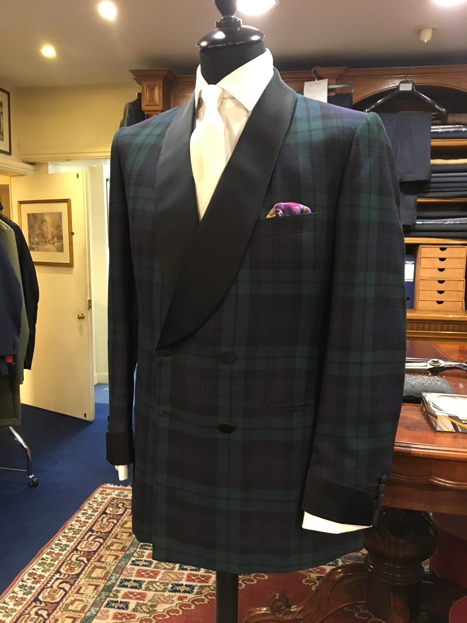 bespoke wedding suit on tailors dummy rotated